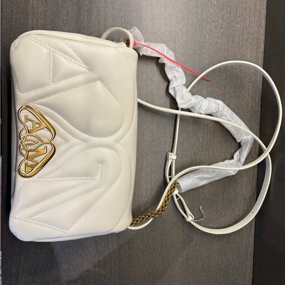 Brand new
Alexander McQueen
small The Seal cross body bag